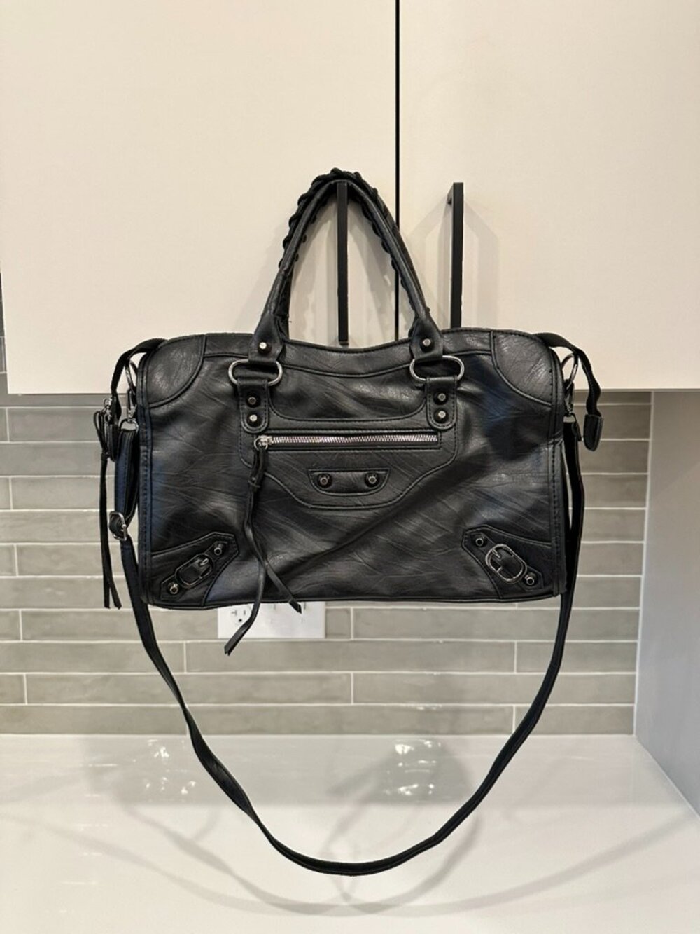 Black distressed faux leather city bag